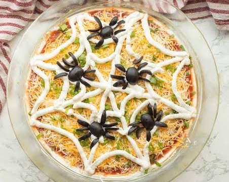 The Best Spiderweb Taco Dip Recipe Ever suggested serving